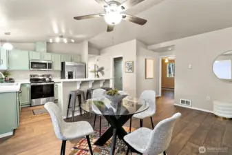 A convenient breakfast bar connects the spaces beautifully, making it easy to cook, dine, and entertain all in one bright, inviting area.