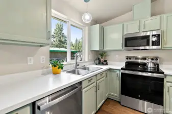 The kitchen is equipped with brand-new stainless steel appliances that all convey, offering a sleek, modern look and the convenience of a truly move-in-ready home.