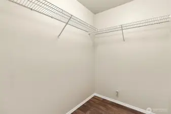 A generous walk-in closet adds comfort and convenience, offering abundant space to stay organized in style.