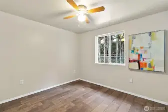 One of the three bedrooms all with new LVP flooring and they all have ceiling fans.