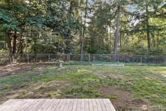 The large, level lot is fully fenced, offering privacy, security, and plenty of usable space for gardening, play, entertaining, or simply relaxing outdoors.