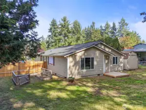 A level, fenced lot with a garden, deck, and storage shed creates the perfect outdoor retreat—ideal for relaxing, entertaining, or enjoying the seasons in style.