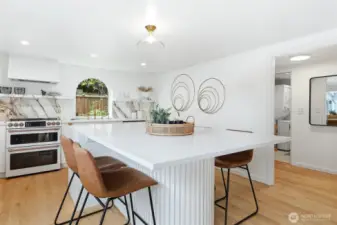 This stylishly updated kitchen is a chef's dream. Huge island is perfect for a gathering with friends or just a quiet breakfast in the morning.