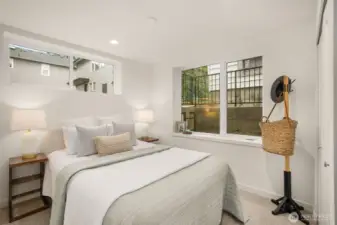 Well-appointed bedroom featuring garden views and a cozy, private atmosphere.