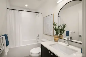 Clean bathroom design with elegant lighting and contemporary hardware.