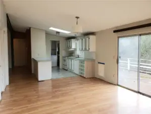 Spacious Kitchen and Second Living Room Showing Skylight, Cathedral Ceiling, Skylight Laminate Flooring.