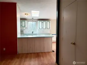 Another View of the Living Room Looking into the Kitchen from the Front Entry Door.