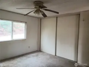Spacious Primary Master Bedroom Showing Full Wall Closet.