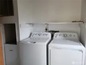 Separate Utility Room with Shelf and Washer Dryer that Stays.