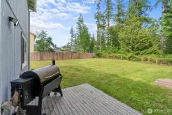 Sunny deck with spacious backyard