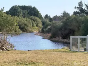 Large backyard with picturesque view of canal