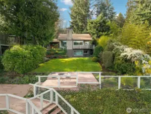 Private back yard with stairs to water