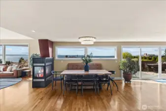 Elegant open concept dining with double sided gas fireplace