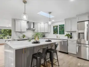 this kitchen is a showstopper with soft colors and new appliances