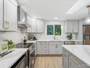 New induction stove, quartz countertops and gold accent fixtures