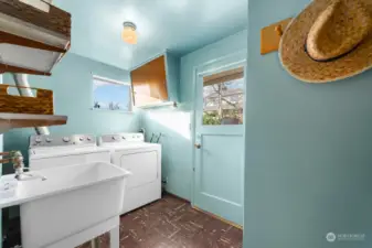 The laundry room features side x side washer & dryer and overhead storage for all your supplies. The utility sink is a handy addition for cleaning up household and backyard projects. The backdoor here leads to the fully fenced, western exposure backyard.