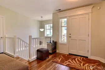 Entry welcomes you with gleaming wood floors throughout the living area