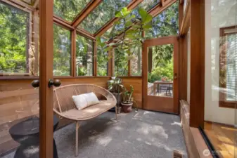 Bathe in natural light year-round in this tranquil sunroom off the kitchen