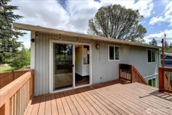 Wonderful deck just outside dining room with steps leading to fully fenced back yard