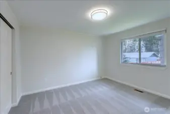 Reverse side of the primary bedroom. Note new carpeting!
