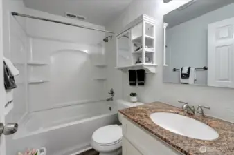 Another beautiful bathroom, this time on the lower level. Also with newer vanity and granite top.