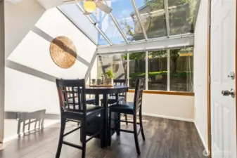 Love this dining nook with garden window! -- And the door out to the backyard for summer barbecues!