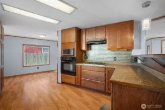 Enjoy cooking with a gas range, complemented by a tile backsplash and plenty of counter space.