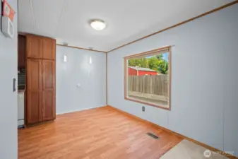 Conveniently situated between the kitchen and living room, the dining area offers a seamless flow.