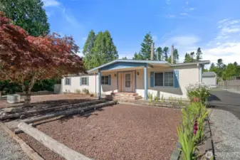 Low-maintenance yard featuring decorative gravel for a clean, tidy appearance.