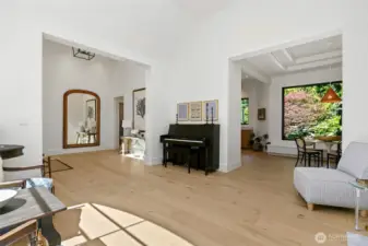 Bright and airy open-concept layout with seamless transitions from formal living to dining and kitchen spaces.