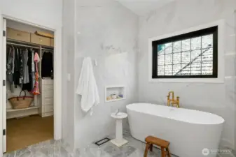 Another look at the soaking tub with natural lighting - with direct access to a spacious walk-in closet.