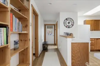 Built-in bookshelves between kitchen and living room.  Bedroom # 2 on the left, 3/4 bath & laundry on the right.