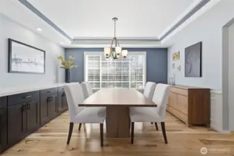 The dining room has tray ceilings and a built in buffet for both storage and entertaining.