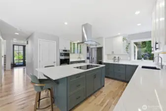 Quartz countertops and stainless steel appliances. Double ovens do it all, including steam bake.