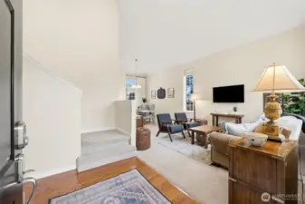 You are welcomed to a bright open space with vaulted ceilings and a beautiful sitting area