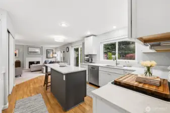 Updated kitchen with new extended island, new cabinets and quartz counters