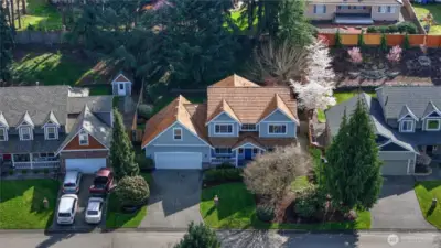 From every angle, this 3-bedroom, 2.5-bath home showcases its spacious design, solid craftsmanship, and charming shake roof that adds character and dimension.