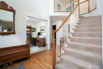 Step inside to a welcoming entry, with a private office to your left and a formal living room to your right—perfectly balancing function and elegance.