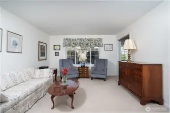 Beautiful formal living room adds a touch of sophistication, ideal for hosting or relaxing in a serene space.