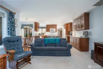 Spacious living area flows seamlessly into the kitchen, creating an open-concept layout perfect for entertaining and everyday living.