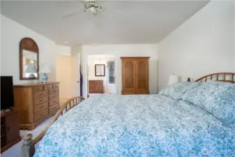 Spacious primary bedroom offers a serene retreat with plenty of room for relaxation and personal style.