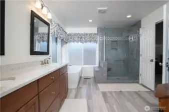 Beautifully updated primary bath features modern finishes, a spacious layout, and a serene retreat-like atmosphere.