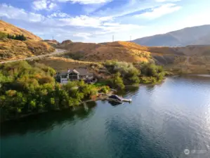 Aerial view of 3bd/5bth 5,247sf home set on 12 acres w/ 535’ of waterfront on the Columbia River and a private dock with 9,000lb boat lift.