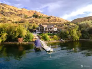 Aerial view of home set on 12 acres w/ 535’ of waterfront on the Columbia River and a private dock with a 9,000lb boat lift.