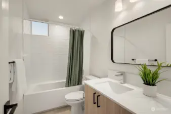 Clean lines and stylish fixtures define this modern bathroom. Relax and refresh in your spa-like retreat after a long day.