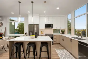 The heart of the home, this gourmet kitchen boasts upgraded stainless steel appliances, a spacious island, and ample storage.