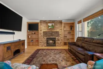Living room off kitchen with stone fireplace