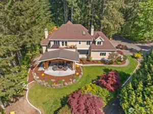 This is the most amazing lot with so many trees & flowers plus a deck off the primary and covered patio