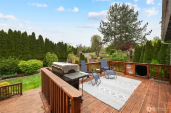View of your beautiful new deck, with access to upper and lower level. Slide access on upper level of deck.