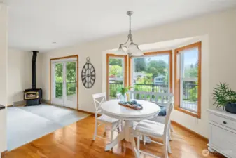 Eating area off kitchen is picturesque. Easy to entertain out onto the deck.